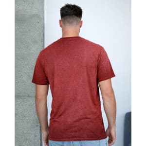 A red Colortone® Oil Wash T-Shirt is displayed from the back, featuring a simple design and short sleeves.