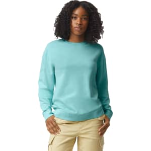 A turquoise crewneck sweatshirt displayed on a model, featuring long sleeves and a classic fit.