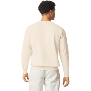 A lightweight crewneck sweatshirt in a cream colour, featuring a classic design and a logo on the back.