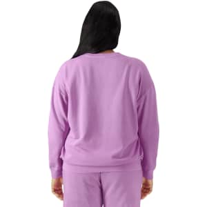 A lightweight crewneck sweatshirt in a soft lavender shade, featuring a relaxed fit and long sleeves.