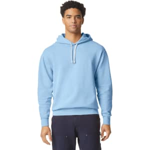 A light blue hooded sweatshirt with a drawstring, featuring a logo on the front. Suitable for casual wear.