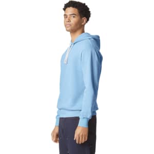 A lightweight hooded sweatshirt in blue, featuring a drawstring and a discreet logo. Suitable for casual wear.