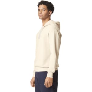 A lightweight hooded sweatshirt in beige, featuring a drawstring hood and a subtle logo.