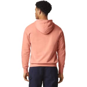 A lightweight hooded sweatshirt in a soft peach colour, featuring a hood and a simple design.