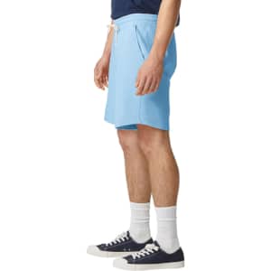 Light blue lightweight sweatshorts with an elastic waistband and side pockets, displayed on a model.