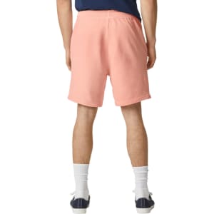 Lightweight sweatshorts in a soft coral colour, featuring an elastic waistband and a logo.