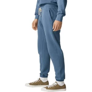 Lightweight track pants in a soft blue colour with a drawstring waist and side pockets. Features branding.