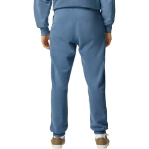 Lightweight sweatpants in a soft blue hue, featuring an elastic waistband and a tapered fit.