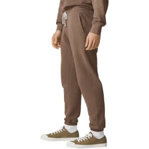 Lightweight brown sweatpants with an elastic waistband and drawstring, featuring side pockets and a casual fit.