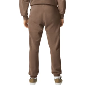 Brown lightweight sweatpants featuring an elastic waistband and tapered legs, displayed from the back view.