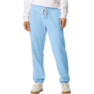Light blue lightweight sweatpants with an elastic waistband and drawstring, featuring a logo on the leg.
