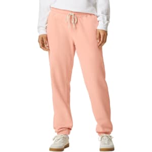 Lightweight sweatpants in a soft pink colour, featuring an elastic waistband and cuffs, with a drawstring.