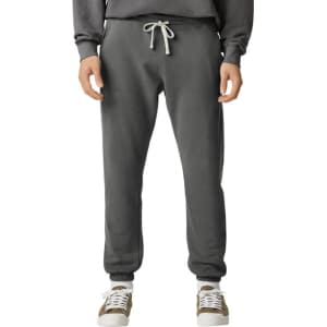 A pair of grey lightweight sweatpants with an elastic waistband and drawstring, featuring pockets and a logo.