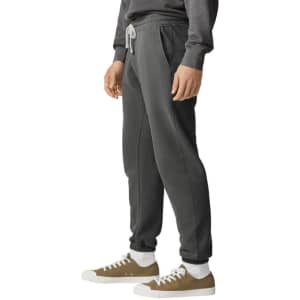 Lightweight grey sweatpants with a relaxed fit and side pockets, featuring a drawstring waist and a logo.