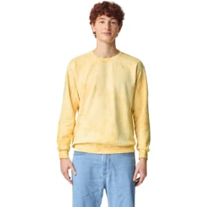 A yellow crewneck sweatshirt with a relaxed fit, featuring a logo. Suitable for casual wear.