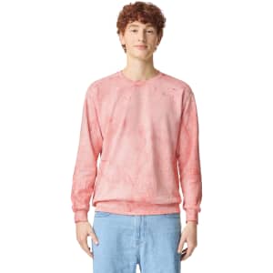 A pink tie-dye crewneck sweatshirt featuring long sleeves and a simple logo on the chest.