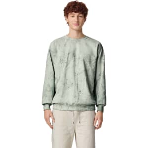 A crewneck sweatshirt in a muted green colour, featuring a soft fabric texture and a logo.