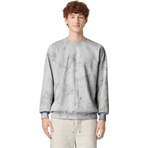 A grey crewneck sweatshirt with a textured design, featuring long sleeves and a relaxed fit. It has a logo.