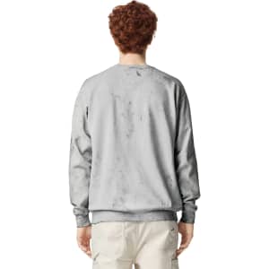 A crewneck sweatshirt in a light grey colour, featuring a simple design and a logo on the back.