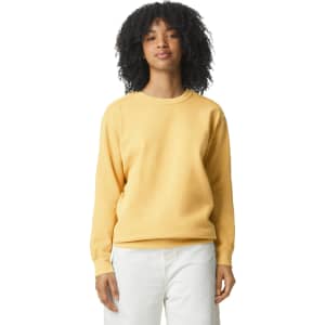 A yellow adult crewneck sweatshirt in a relaxed fit, featuring long sleeves and a logo.