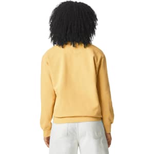 A back view of a yellow adult crewneck sweatshirt with a branded logo. The model wears light-coloured pants.