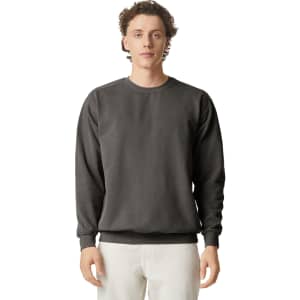 A crewneck sweatshirt in a dark grey colour, featuring a simple design and a logo on the front.