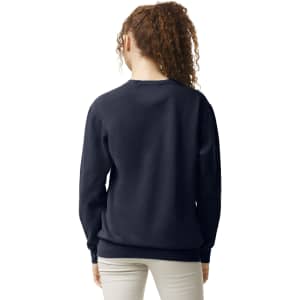 A navy adult crewneck sweatshirt with a relaxed fit, featuring a simple design and a logo on the back.