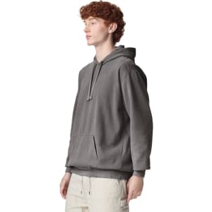A grey adult hooded sweatshirt with a front pocket and drawstring hood, featuring a logo on the chest.