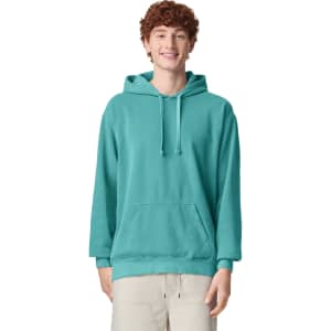A turquoise adult hooded sweatshirt with a front pocket and a drawstring hood, featuring a logo.