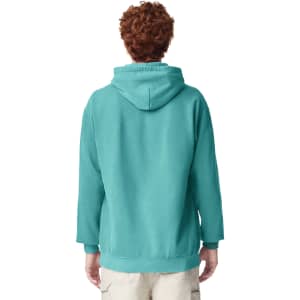A teal adult hooded sweatshirt with a kangaroo pocket and adjustable hood, featuring a logo.