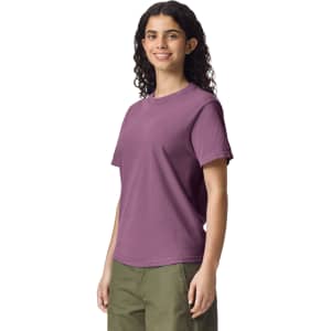 A purple adult heavyweight T-shirt displayed on a model, featuring short sleeves and a relaxed fit.