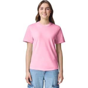 A pink adult heavyweight t-shirt with short sleeves, featuring a logo on the front.