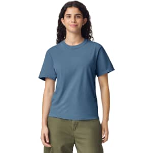 A blue heavyweight t-shirt featuring a simple design and a logo, displayed on a model in casual attire.