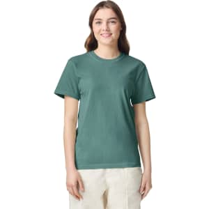 A green heavyweight t-shirt with a classic fit, featuring short sleeves and a round neckline, displayed on a model.