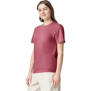 A maroon adult heavyweight T-shirt on a model, featuring a simple design and short sleeves.
