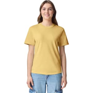 A yellow adult heavyweight t-shirt featuring a round neckline and short sleeves, displayed on a model.
