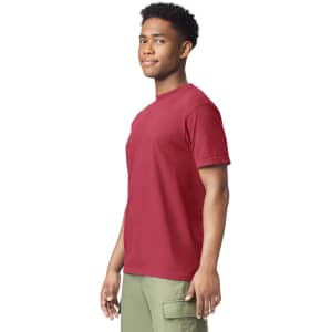 A red heavyweight t-shirt displayed on a model, featuring short sleeves and a crew neck. The model has a neutral expression.
