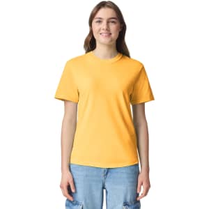 A yellow adult heavyweight t-shirt displayed on a model, featuring short sleeves and a round neckline.