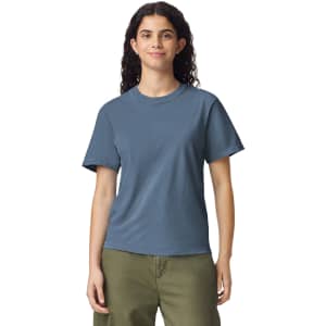 A blue heavyweight t-shirt on a model, featuring a round neckline and short sleeves. The shirt has a logo.