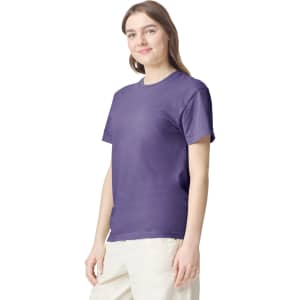 A purple adult heavyweight T-shirt displayed on a model, featuring a crew neck and short sleeves.