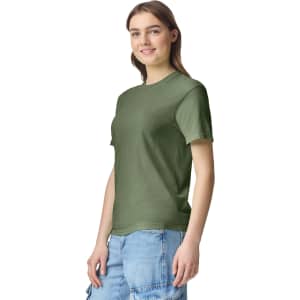 A green adult heavyweight T-shirt is featured, displayed on a model with a neutral expression and casual attire.