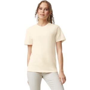 A lightweight heavyweight cream adult t-shirt with a round neckline and short sleeves. The model has a casual pose.