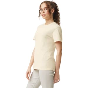 A light beige heavyweight T-shirt with short sleeves, featuring a subtle logo.
