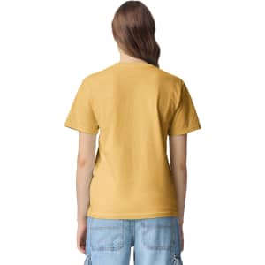 A back view of a yellow heavyweight adult T-shirt. The shirt has a simple design and is worn with casual blue shorts.