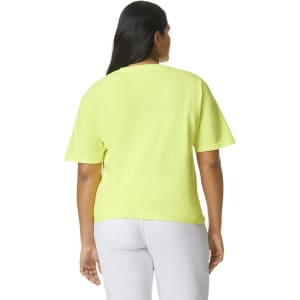 A bright yellow heavyweight t-shirt with short sleeves and a relaxed fit, featuring a logo on the back.