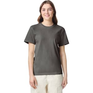 A grey heavyweight t-shirt displayed on a model with a simple design and logo detail.