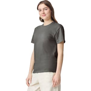 A grey heavyweight t-shirt on a model, featuring a classic crew neck and short sleeves. The shirt has a logo.