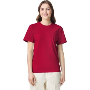 A red adult heavyweight T-shirt displayed on a model, featuring a crew neckline and short sleeves.