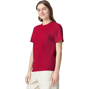 A red adult heavyweight T-shirt on a model, featuring a classic crew neckline and short sleeves.