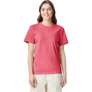 A pink adult heavyweight T-shirt displayed on a model, featuring short sleeves and a round neckline.